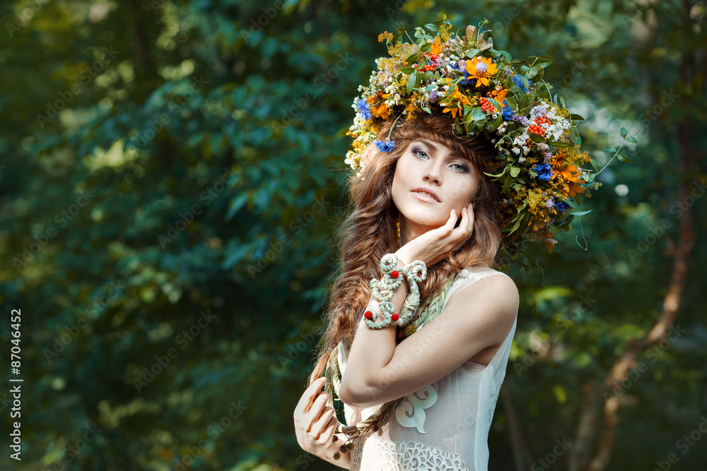 Beautiful girl with wreath on the head of field flowers. Beautiful girl with wreath on the head of field flowers.