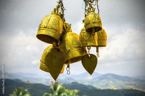 Gold oriental musical bells on open air Thailand