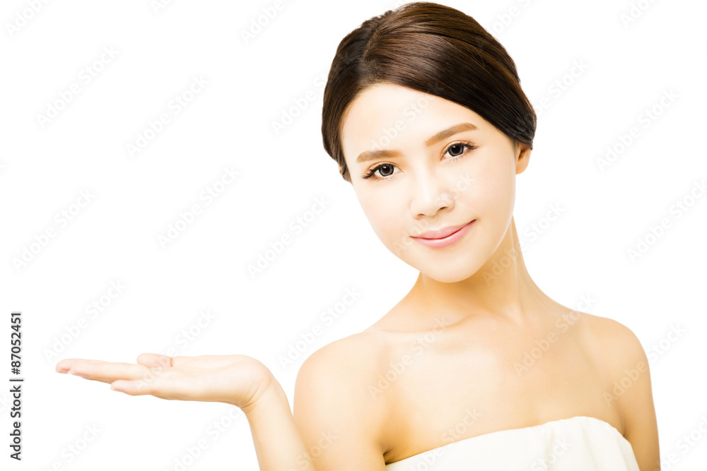 beautiful young woman showing beauty product empty space on hand beautiful young woman showing beauty product empty space on hand