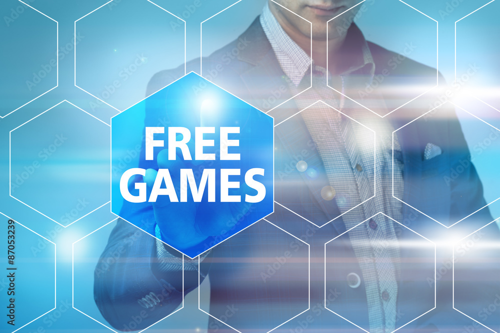 Businessman pressing free games button on virtual screens. Busin Businessman pressing free games button on virtual screens. Busin
