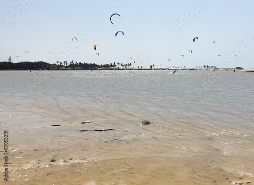 Kitesurfers practicing on lagoon water