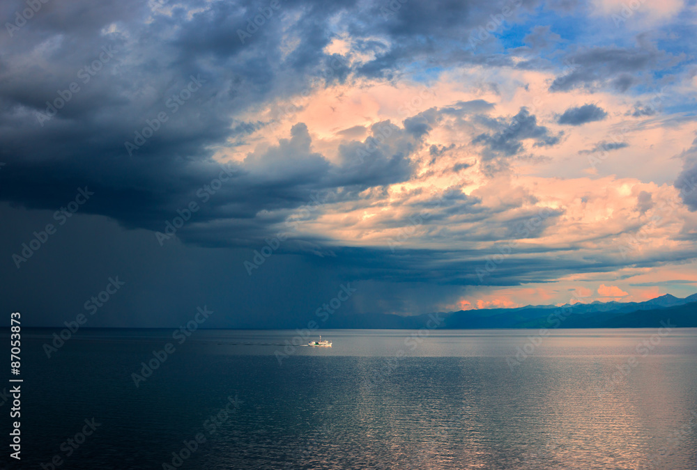 Thunderstorm on of South part lake Baikal evening in July