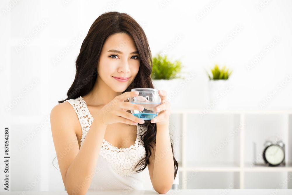 relaxed young smiling woman drinking clean water relaxed young smiling woman drinking clean water