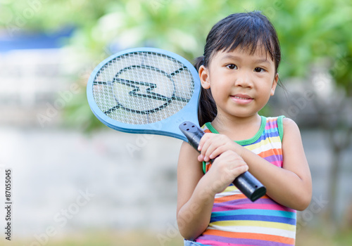 Cute asian holds electronic mosquito trap © kwanchaichaiudom
