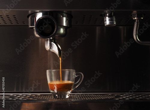 Hot coffee flow to a cup on espresso machine