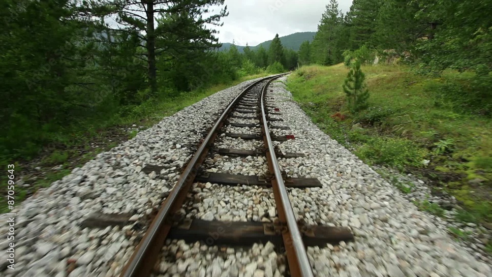 Narrow gauge railway - camera flying over rails, steadicam shot Narrow gauge railway - camera flying over rails, steadicam shot