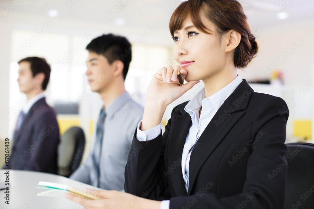 business woman with her staff in conference room business woman with her staff in conference room
