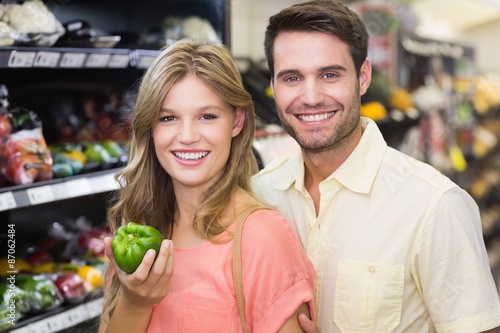 Portrait of smiling bright couple buying food products © WavebreakMediaMicro