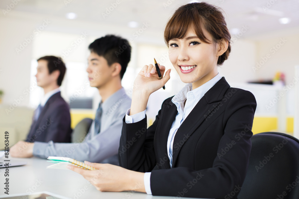 business woman with her staff in conference room business woman with her staff in conference room