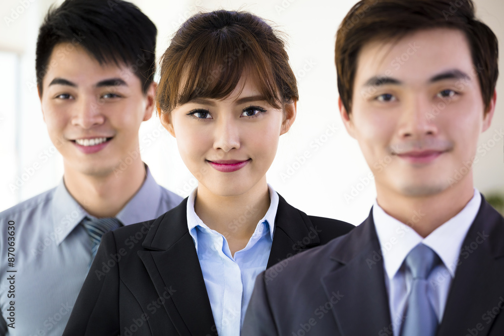successful young business team standing in office successful young business team standing in office