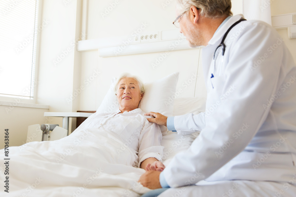 Fototapeta premium doctor visiting senior woman at hospital ward