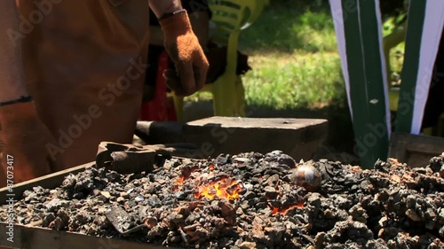 Wallpaper Mural Manual Labor Blacksmith Pounding a Hammer on Hot Metal. Torontodigital.ca