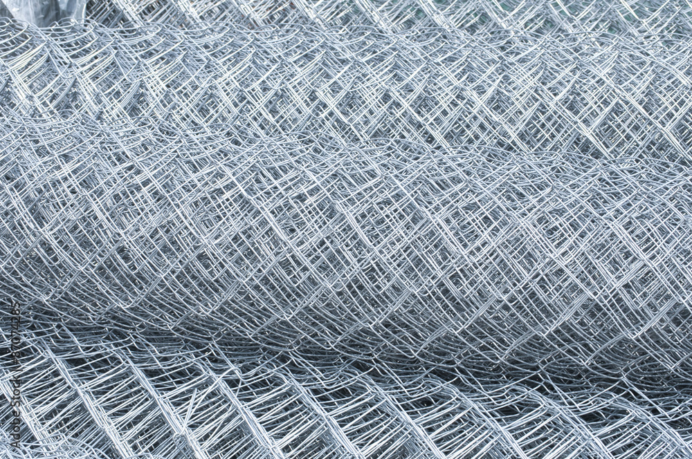 Rolled up metal galvanized fence nets closeup