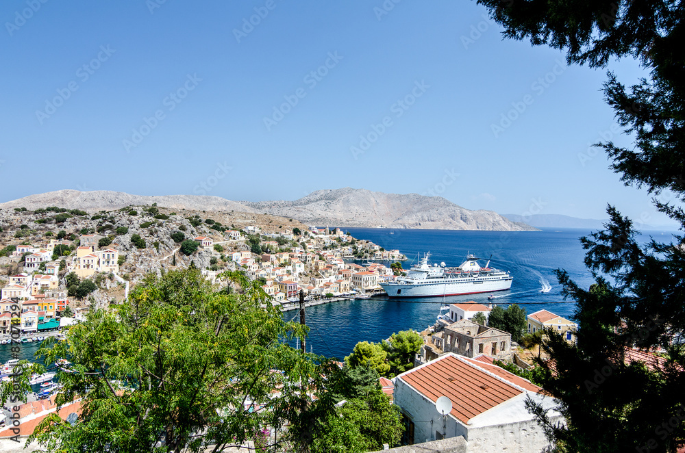View on the Symi island harbor with cruise ship