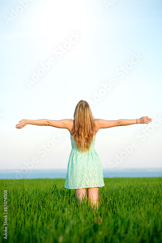 Happiness woman stay outdoor under sunlight of sunset