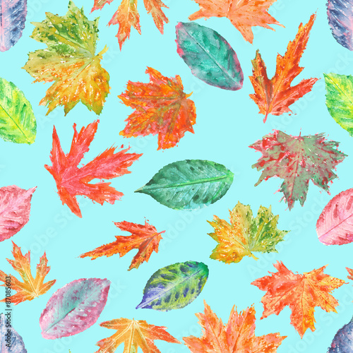 Seamless pattern with bright autumn leaves painted in watercolor on a turquoise background