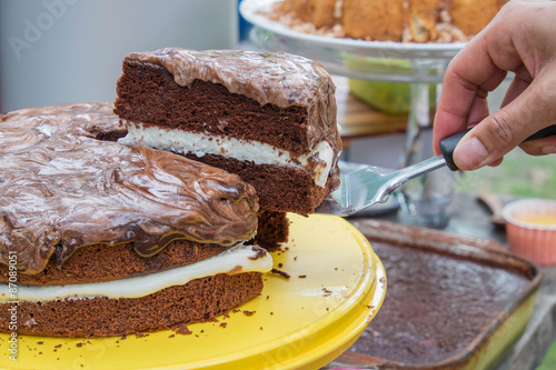 Sliced chocolate layer cake on a platter