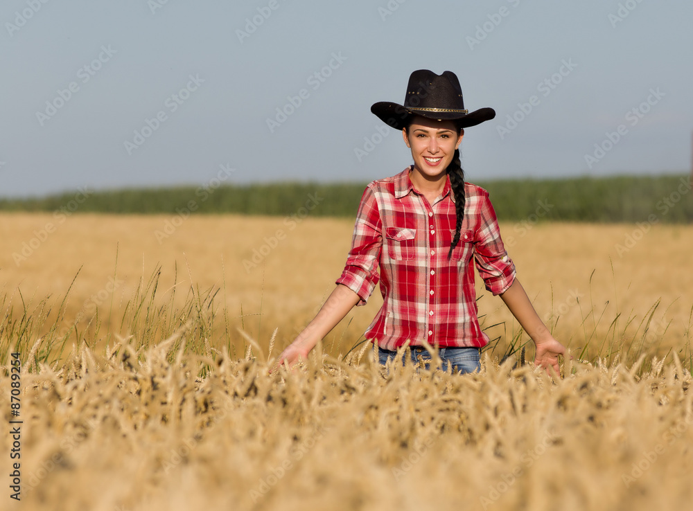 Girl with cowboy hat in wheat field Girl with cowboy hat in wheat field