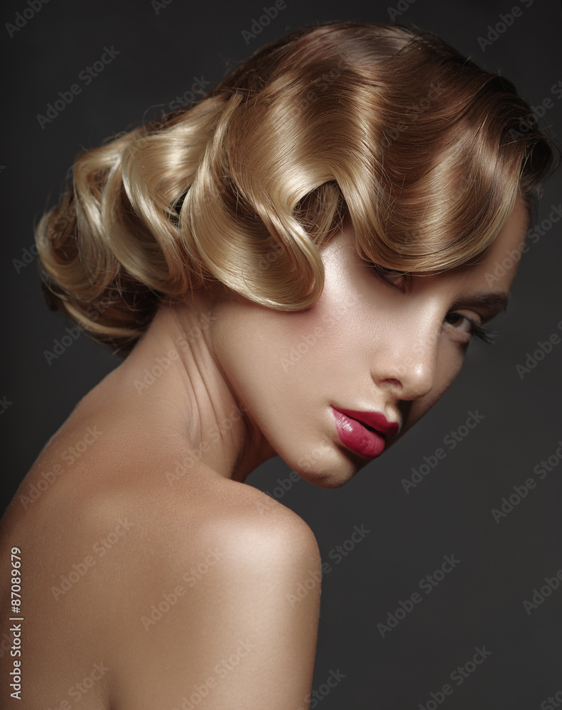 Half-turned Portrait of a beautiful girl on a dark background Half-turned Portrait of a beautiful girl on a dark background