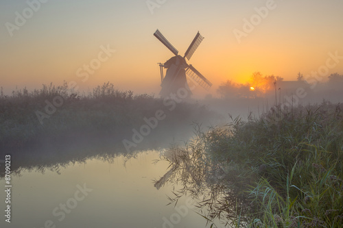 Windmill in dutch countryside