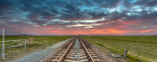 Infinite railroad panorama in open rural countryside