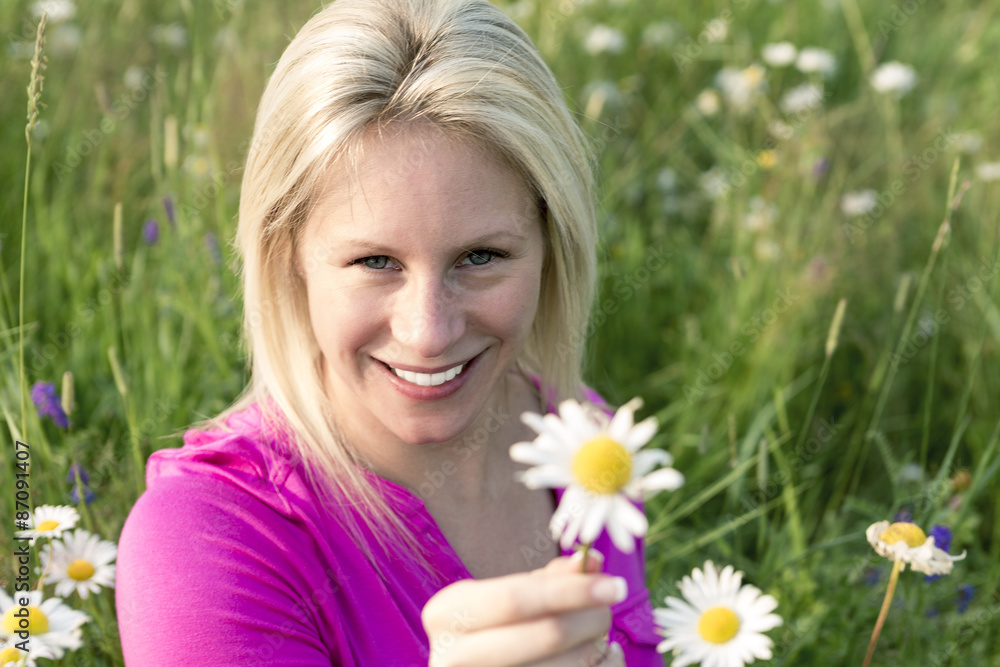 Photo of pretty blonde woman on a field Photo of pretty blonde woman on a field