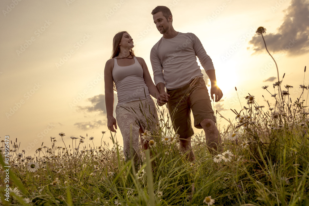 Young couple in love outdoor at the sunset Young couple in love outdoor at the sunset