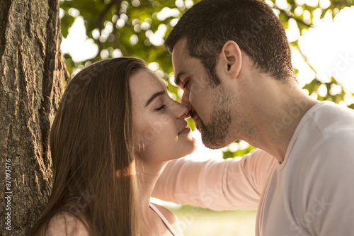 Young couple in love outdoor at the sunset