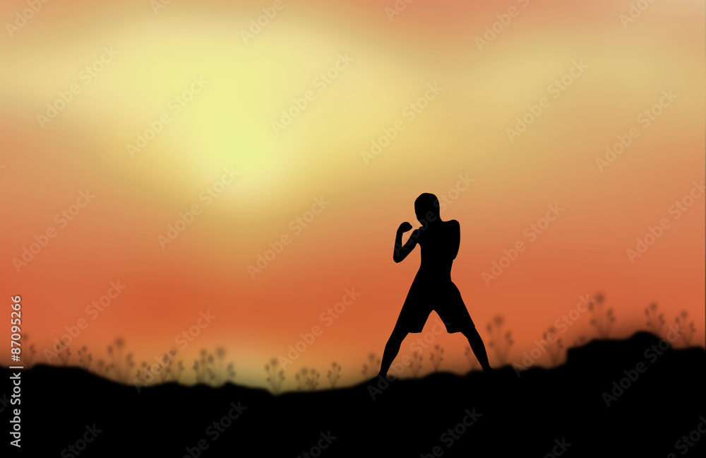 Silhouette man fight Sunset background