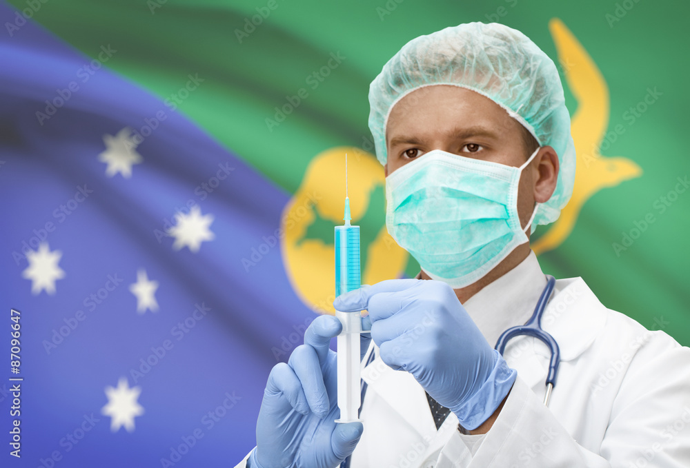 Doctor with syringe in hands and flag on background series - Christmas Island Doctor with syringe in hands and flag on background series - Christmas Island
