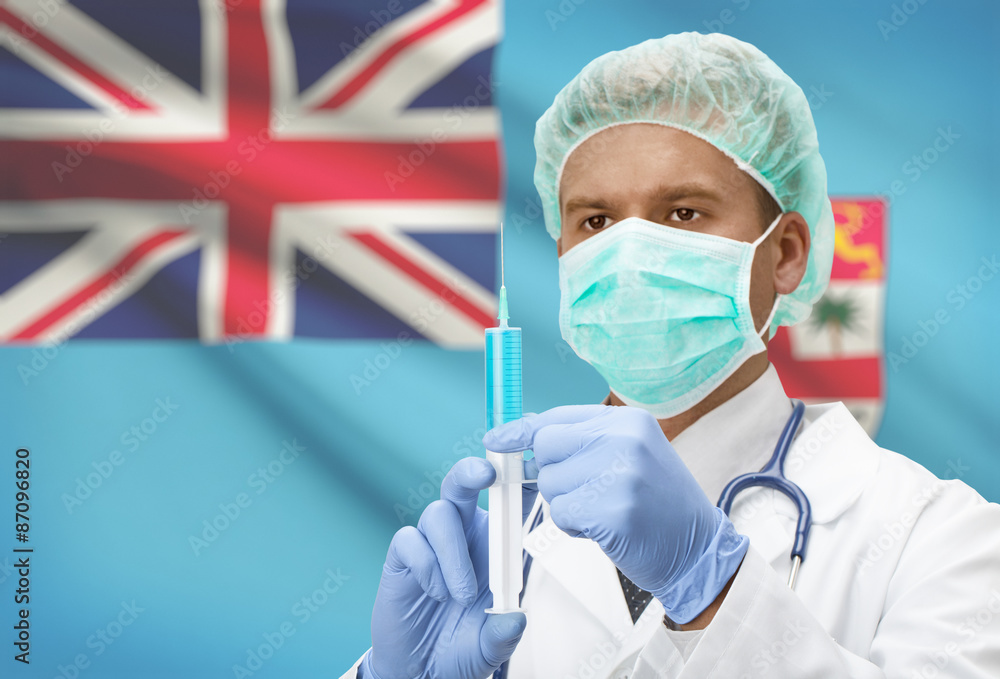 Doctor with syringe in hands and flag on background series - Fiji Doctor with syringe in hands and flag on background series - Fiji