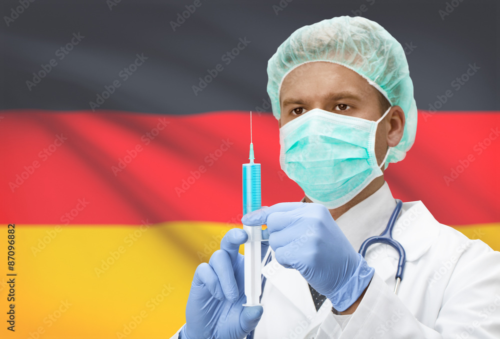 Doctor with syringe in hands and flag on background series - Germany Doctor with syringe in hands and flag on background series - Germany