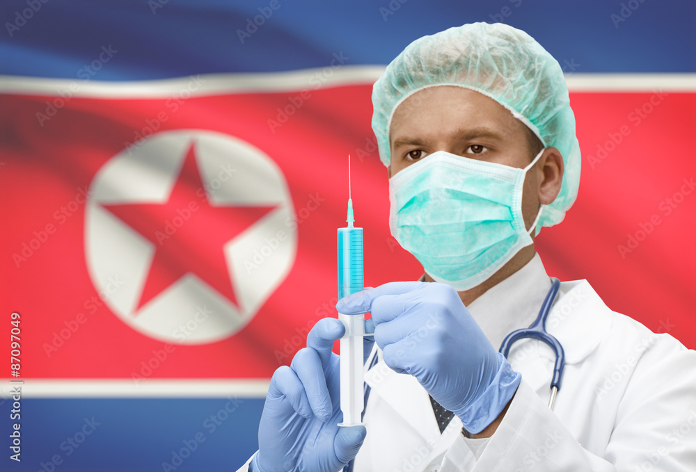Doctor with syringe in hands and flag on background series - North Korea Doctor with syringe in hands and flag on background series - North Korea