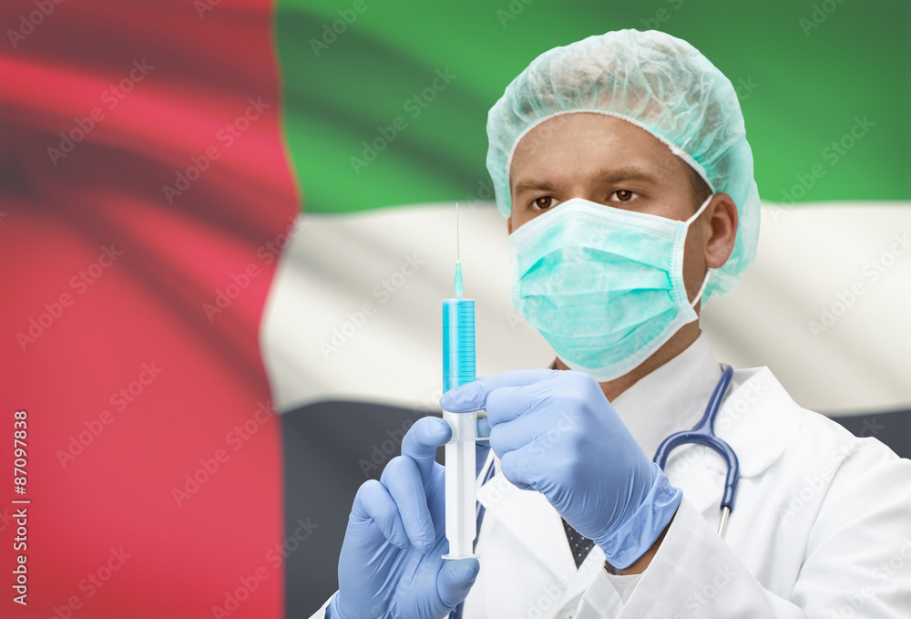 Doctor with syringe in hands and flag on background series - United Arab Emirates Doctor with syringe in hands and flag on background series - United Arab Emirates
