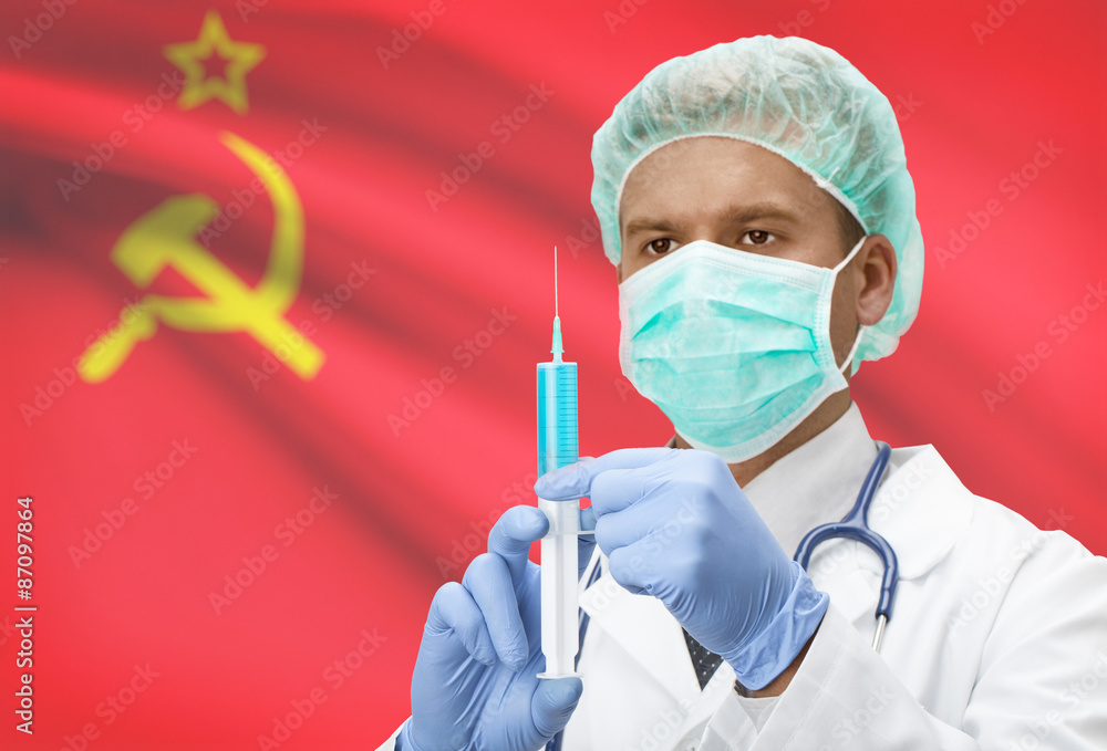 Doctor with syringe in hands and flag on background series - USSR - Soviet Union Doctor with syringe in hands and flag on background series - USSR - Soviet Union