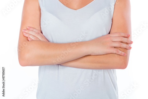 Wallpaper Mural Portrait of a young happy girl after fitness holding hands on the chest isolated on white background Torontodigital.ca