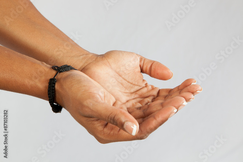 cupped hands to receive