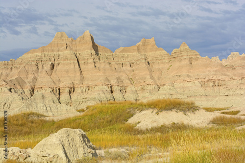 Colorful Badlands Formations Against Stormy Skies