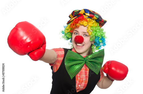 Female clown with box gloves  isolated on white © Elnur