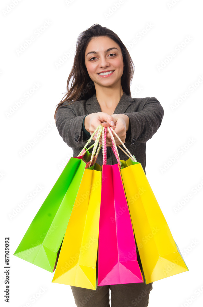 Attractive woman with shopping bags isolated on white