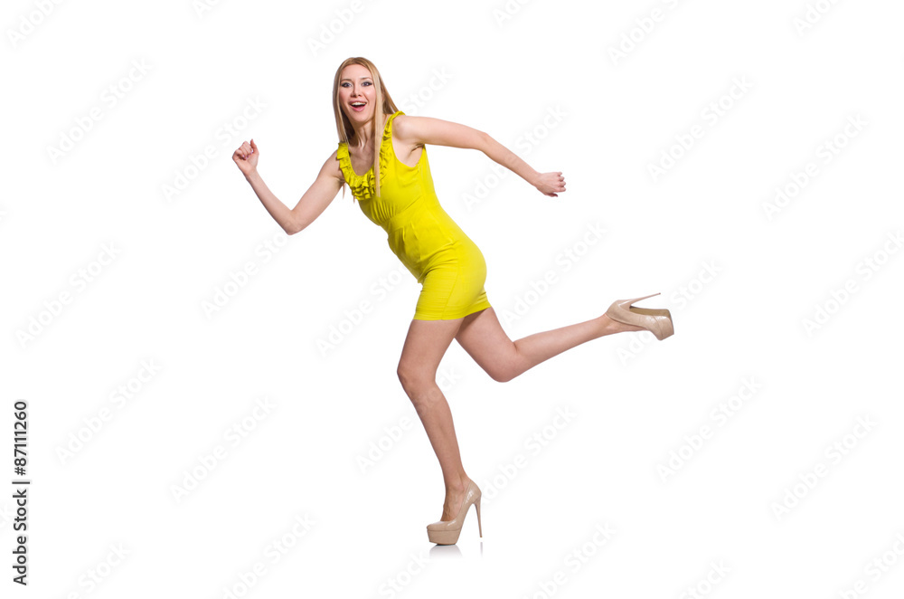 Pretty tall woman in short yellow dress isolated on white
