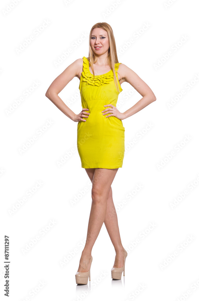 Fototapeta premium Pretty tall woman in short yellow dress isolated on white