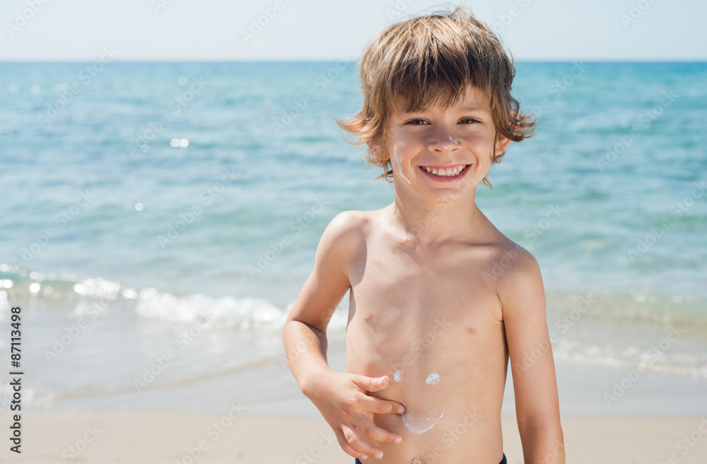 child draws smile on your body with sunscreen protection child draws smile on your body with sunscreen protection