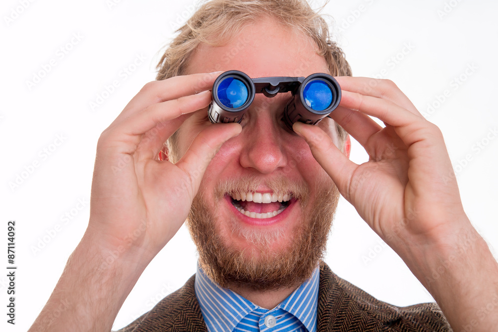 Excited man watching through binoculars Excited man watching through binoculars
