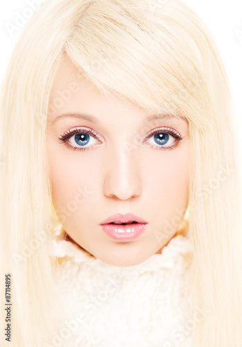 Beautiful girl with platinum blonde hair. Natural make up. Hair color and cosmetic image. 