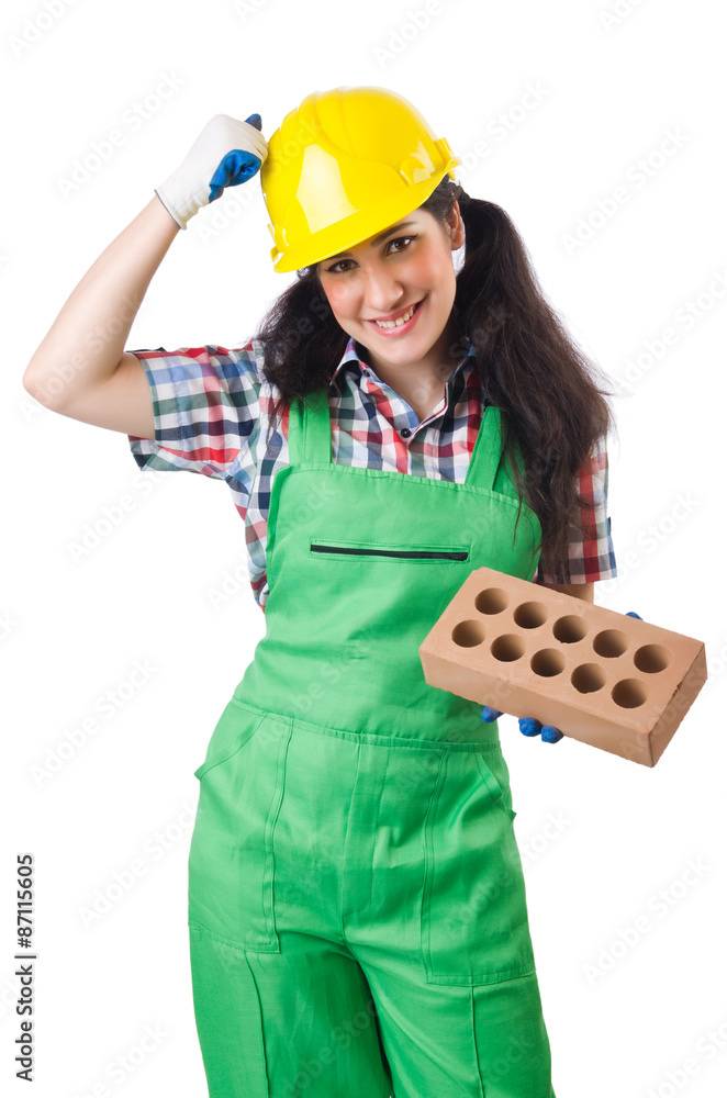 Female workman in green overalls holding brick isolated on white Female workman in green overalls holding brick isolated on white
