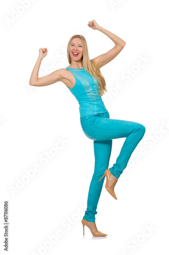 Pretty blond woman in blue pants and shirt isolated on white