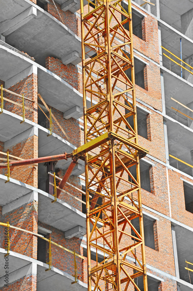 Crane and building construction site with balcony Crane and building construction site with balcony