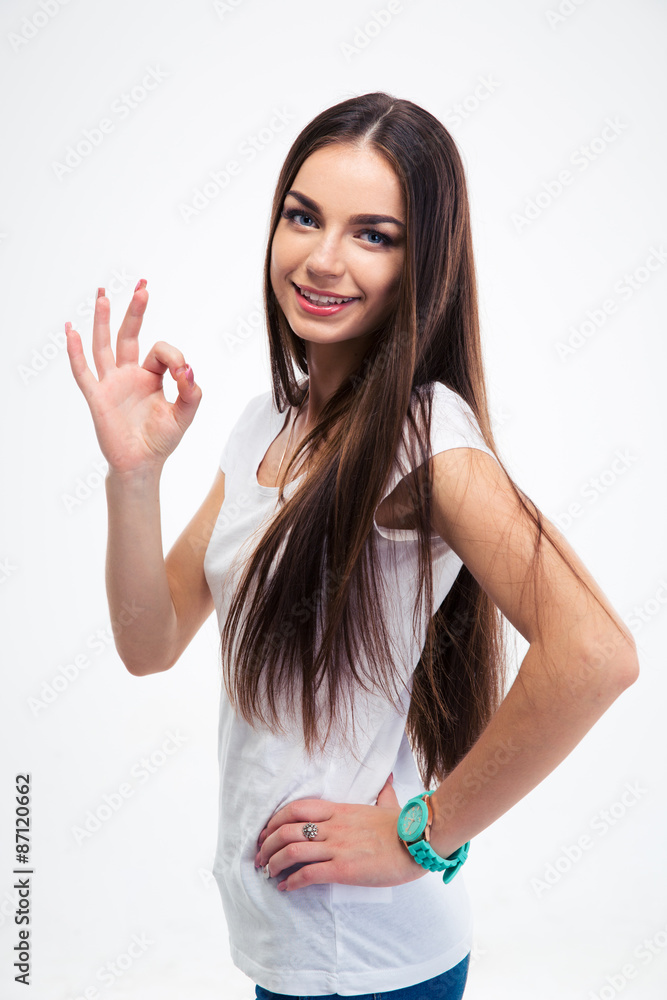 Smiling woman standing with arms folded Smiling woman standing with arms folded