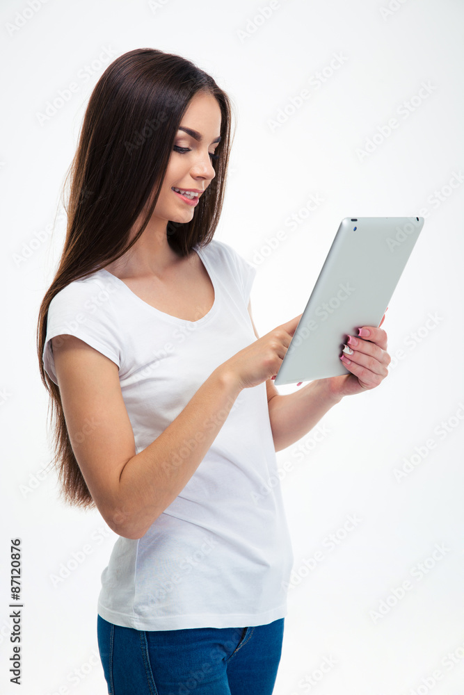 Smiling woman using tablet computer Smiling woman using tablet computer